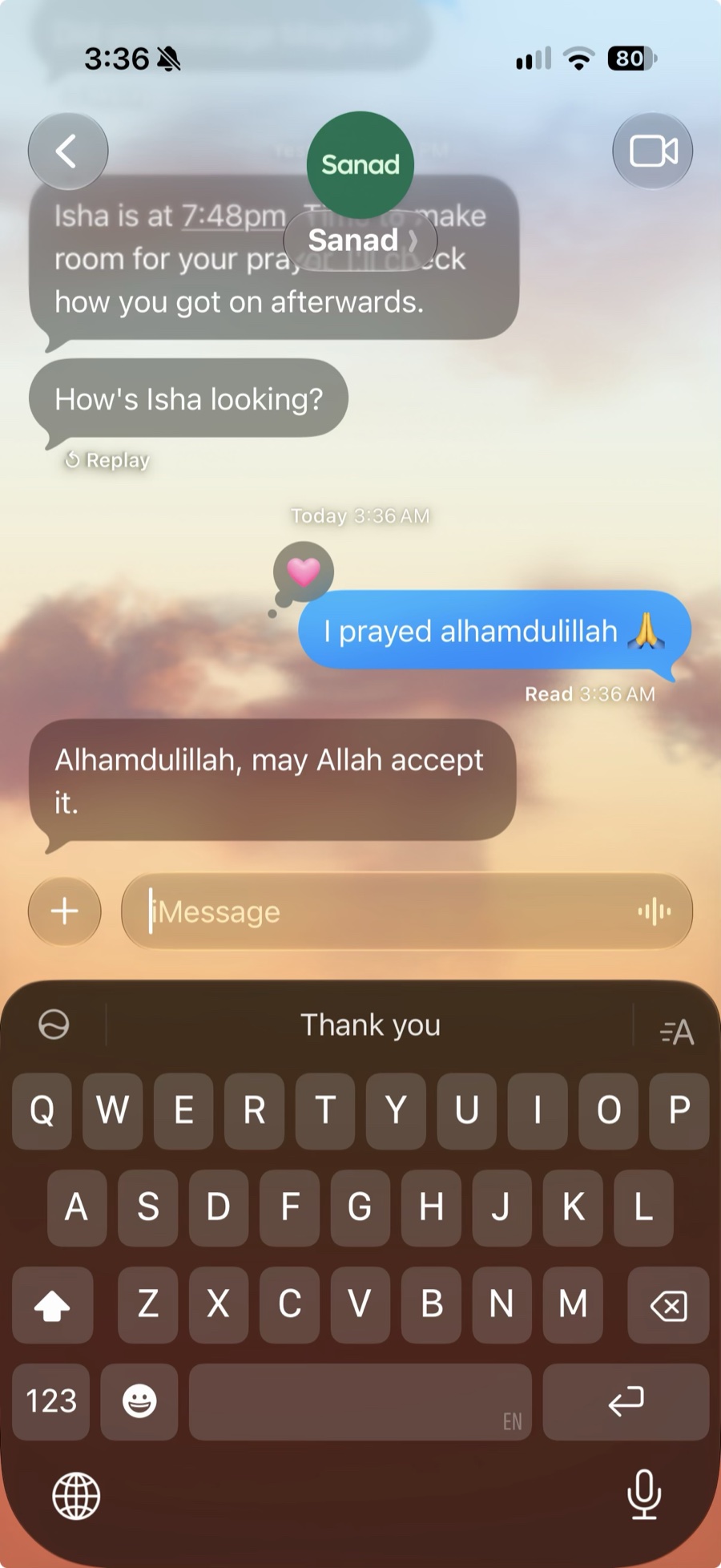 A Sanad chat in Messages: the Isha reminder, the check-in “How’s Isha looking?”, the reply “I prayed alhamdulillah” with a heart on it, and Sanad’s “Alhamdulillah, may Allah accept it.”